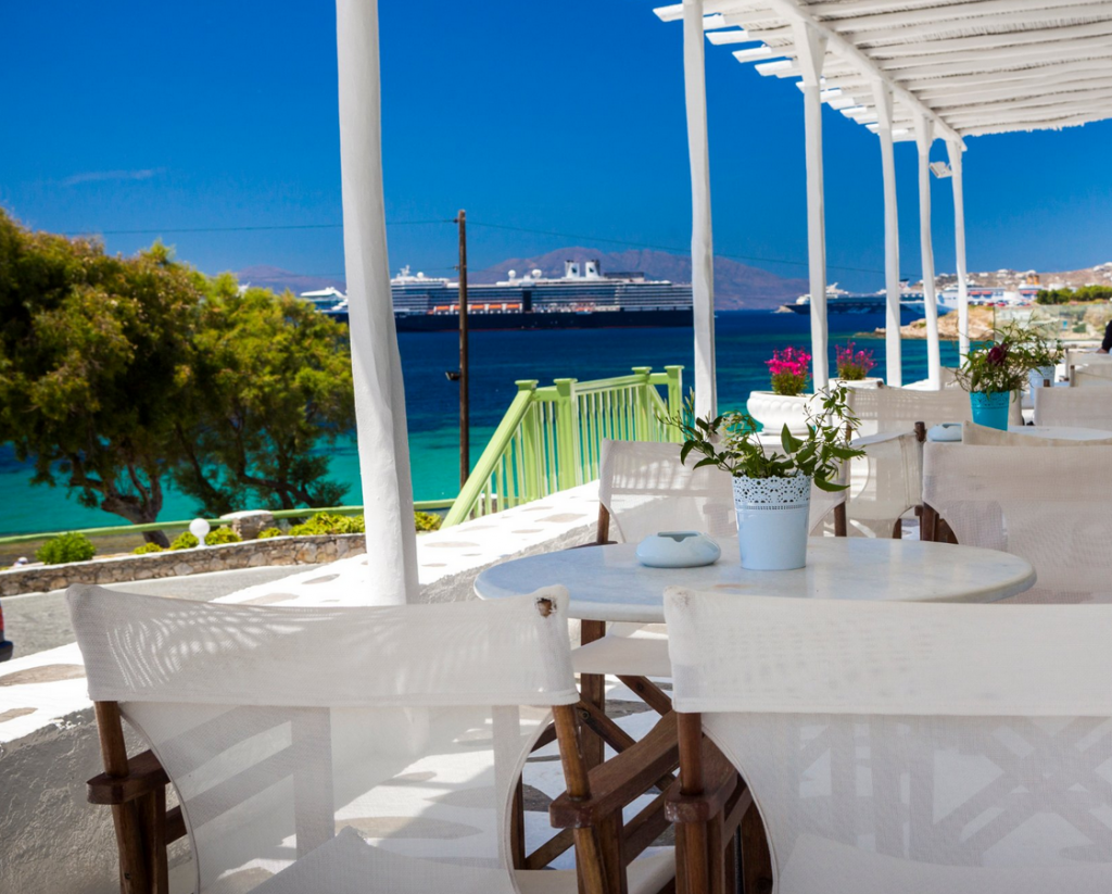 Best Mykonos hotels with infinity pools - Outdoor dining area at Mykonos Beach Hotel