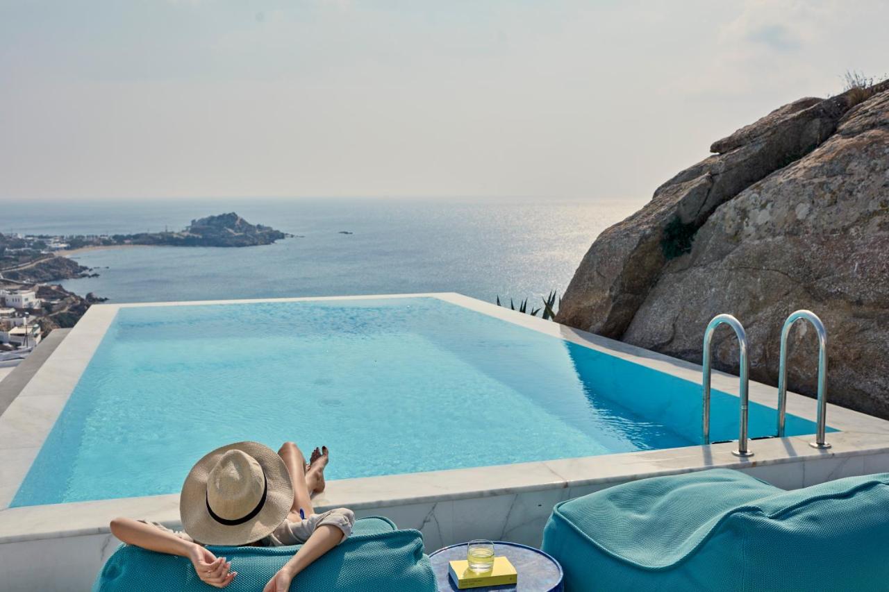 Mykonian Ambassador hotel - relaxing at the pool, with a view of the sea